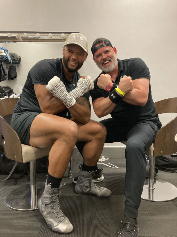 Frazer Clarke (left) and Ian Gatt (right) sitting down posing for the camera