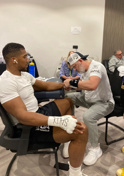 Anthony Joshua's (left) wraps being done by Ian Gatt (right) before a fight