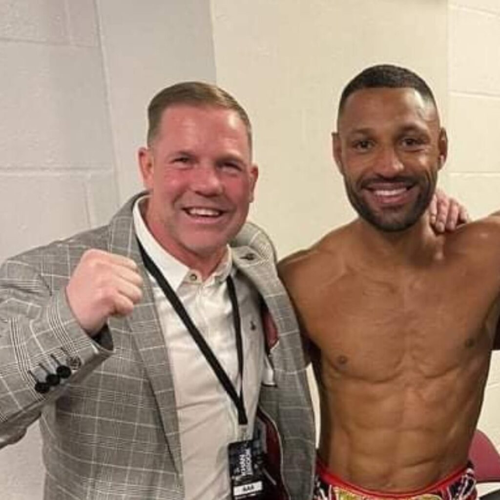 Carl Greaves (left) posing with one of this fighters on the right