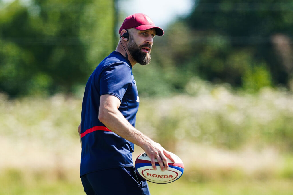 Johnathan Pendlebury holding a rugby ball at an England rugby U18s training session