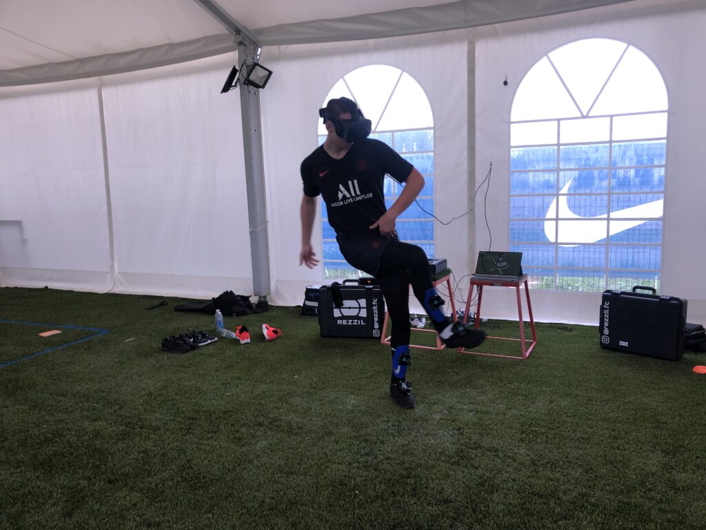 Shows a player wearing a VR headset practicing passing using one of Rezzil's systems