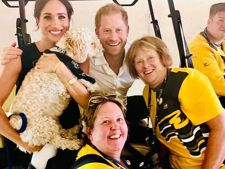 Karolyn Gaston (bottom middle) with fellow volunteer (right) and Prince Harry (top middle) and Duchess of Sussex Meghan Markle (left) at the Invictus Games 2023 in Dussledorf